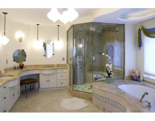 66 Mason Terrace Brookline, MA 02446 - Photo 9 of 13 a bathroom with a granite countertop sink a mirror and a shower