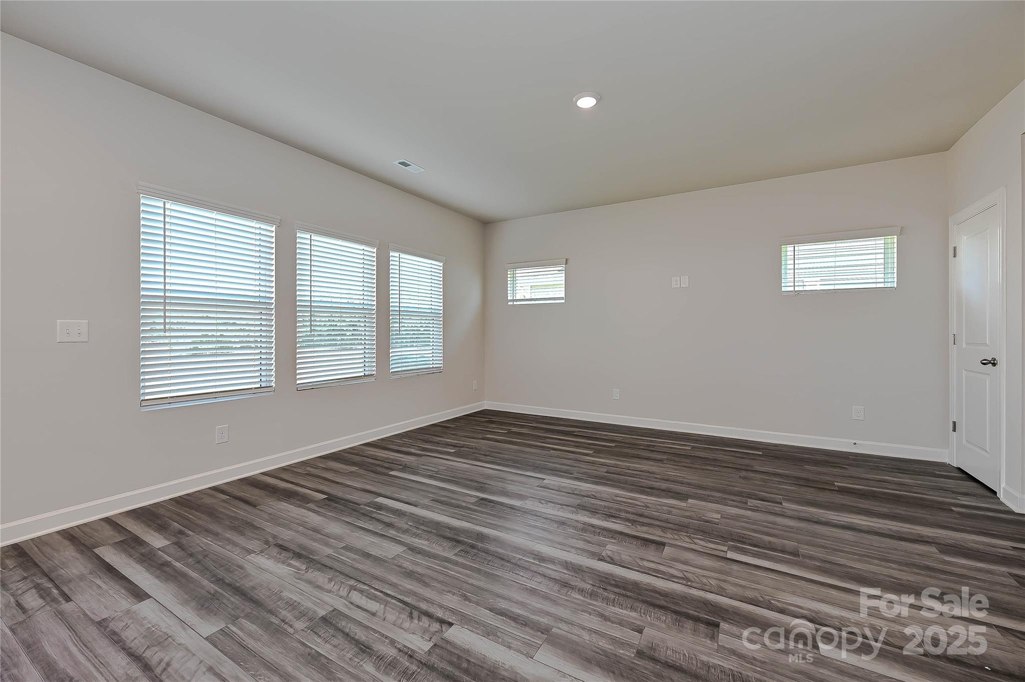 5018 Poplin Valley Cherryville, NC 28021 - Photo 8 of 16 a view of an empty room with wooden floor and a window