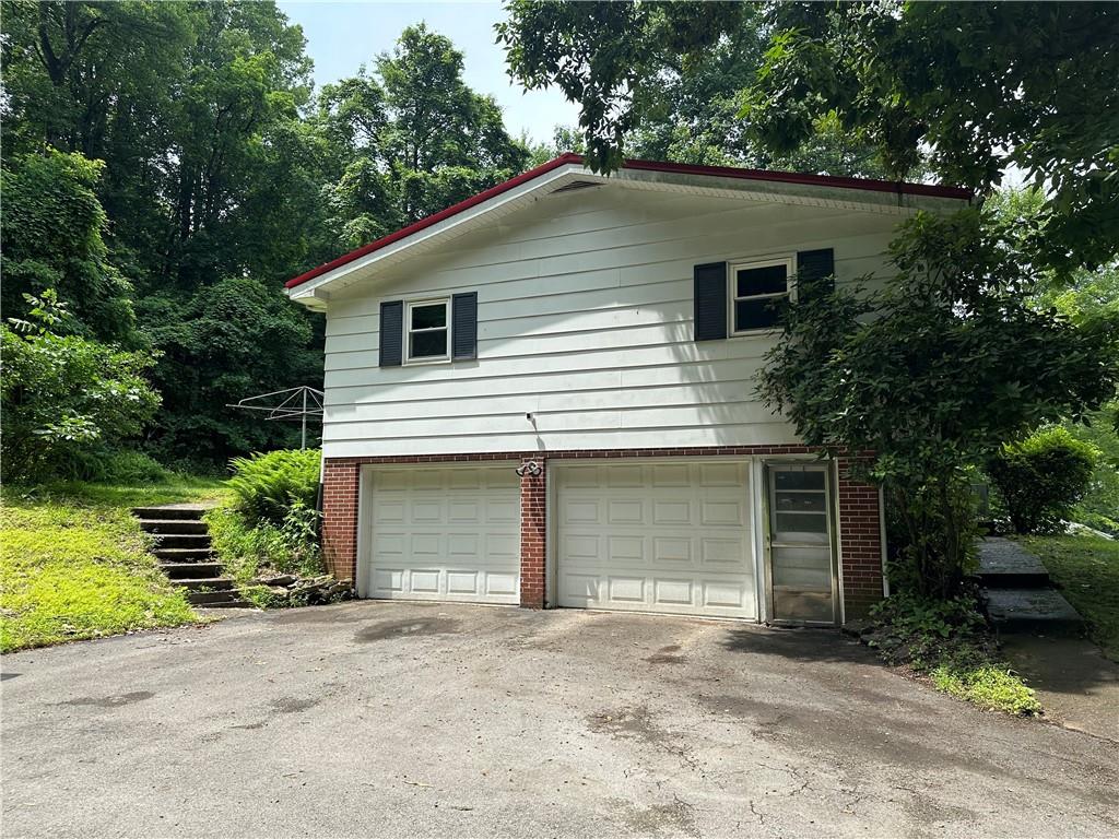 245 T700 Indiana, PA 15701 - Photo 15 of 15 a house with a yard and garage