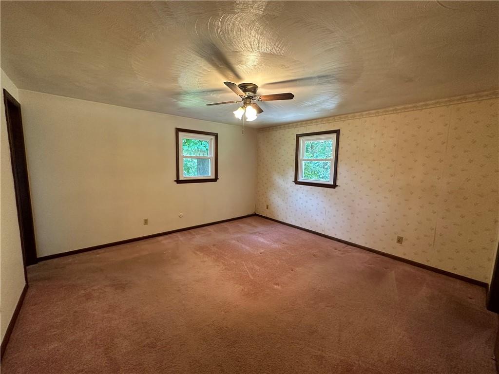 245 T700 Indiana, PA 15701 - Photo 9 of 15 an empty room with windows and ceiling fan