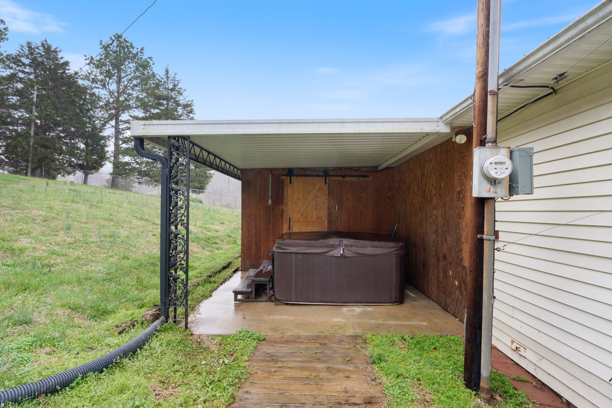 121 Deer Creek Road McEwen, TN 37101 - Photo 11 of 35 a view of backyard with barbeque grill and wooden fence