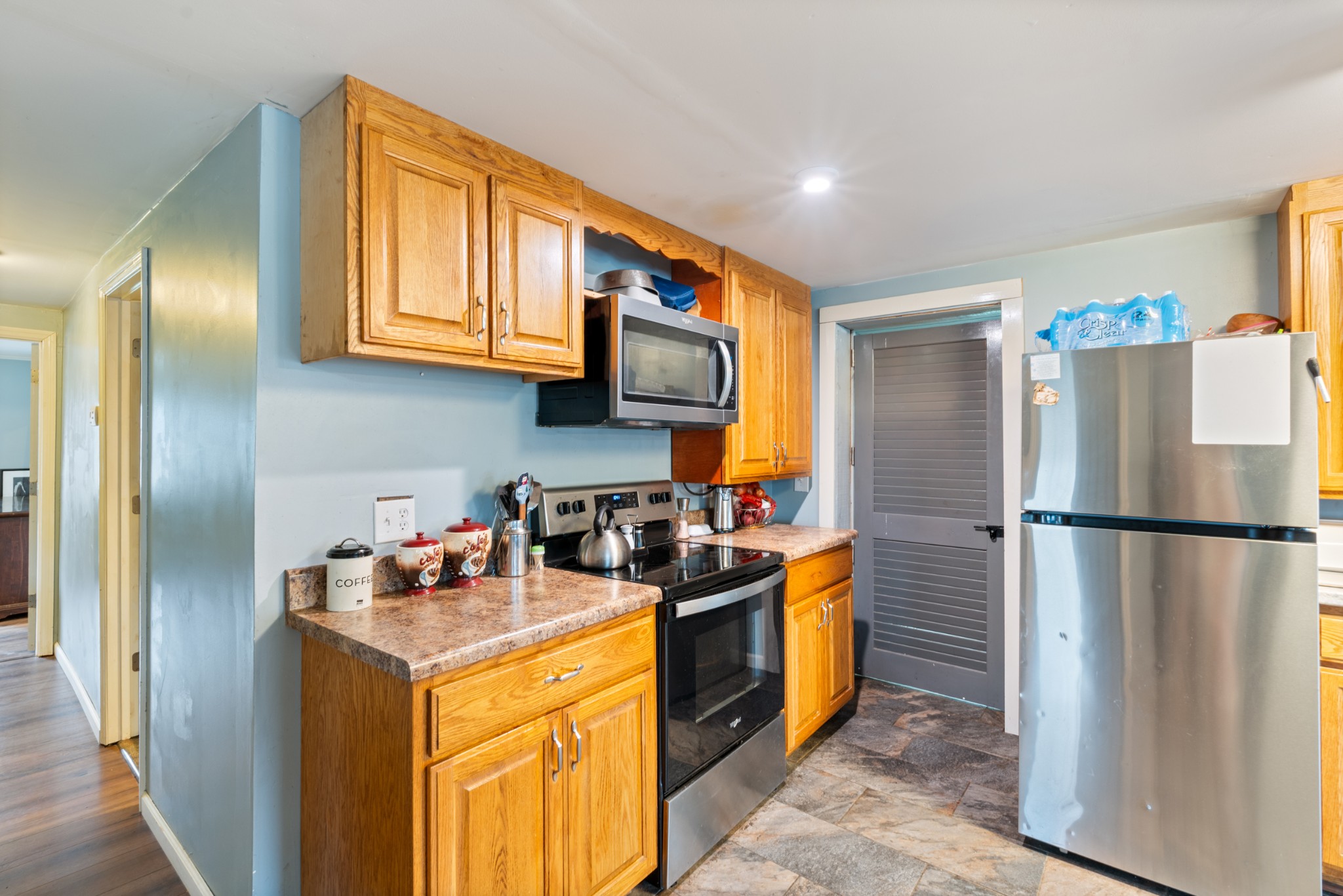 121 Deer Creek Road McEwen, TN 37101 - Photo 21 of 35 a kitchen with a refrigerator a stove top oven a sink and dishwasher
