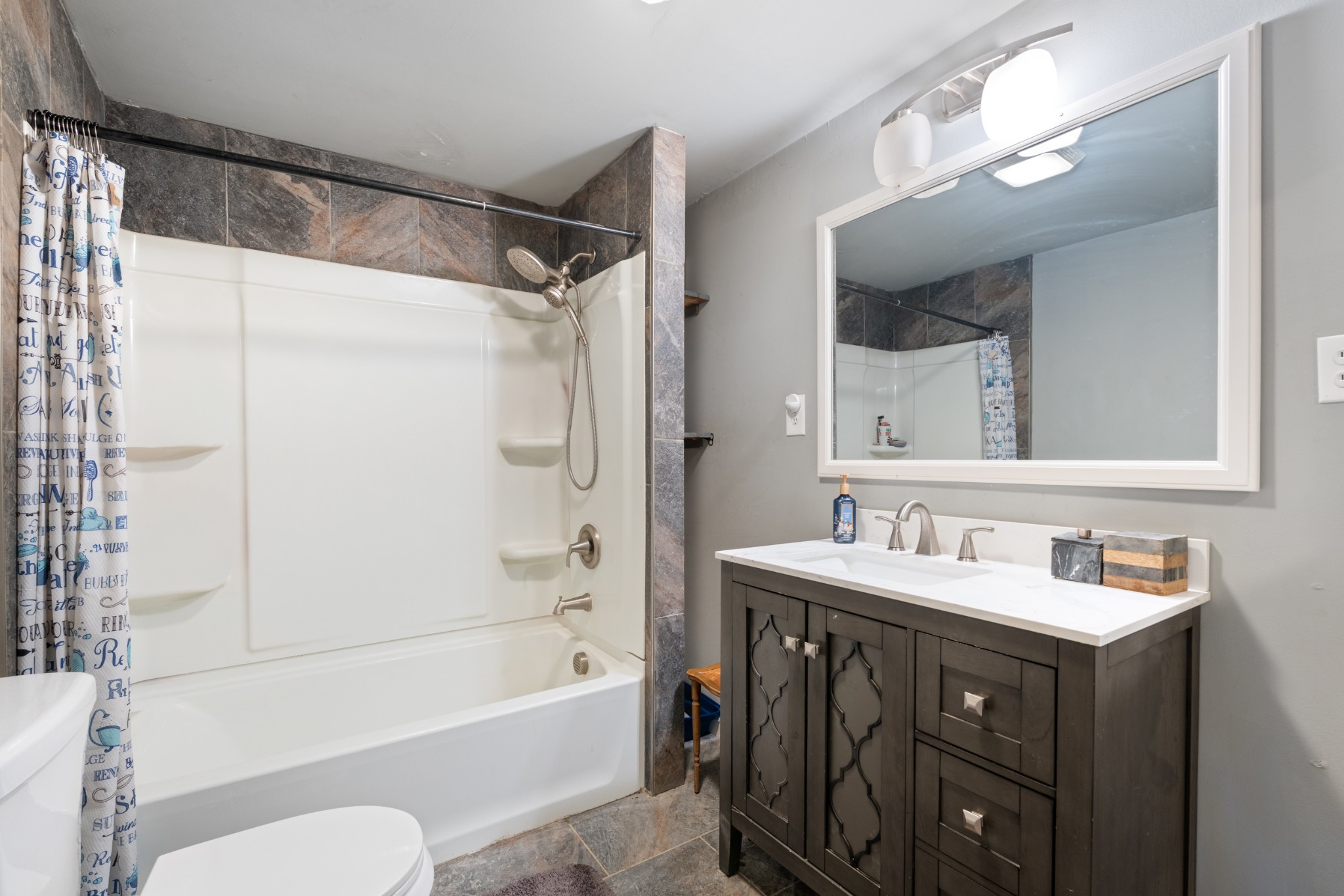 121 Deer Creek Road McEwen, TN 37101 - Photo 27 of 35 a bathroom with a sink vanity mirror and bathtub