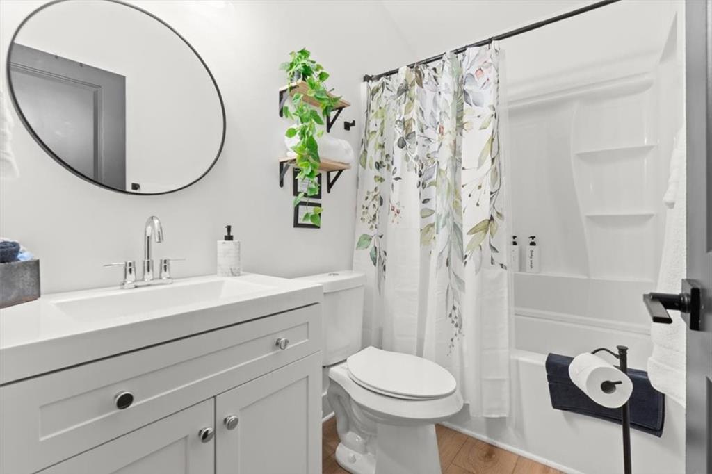 496 Meadow Lane Talking Rock, GA 30175 - Photo 32 of 62 a bathroom with a sink a toilet and a mirror