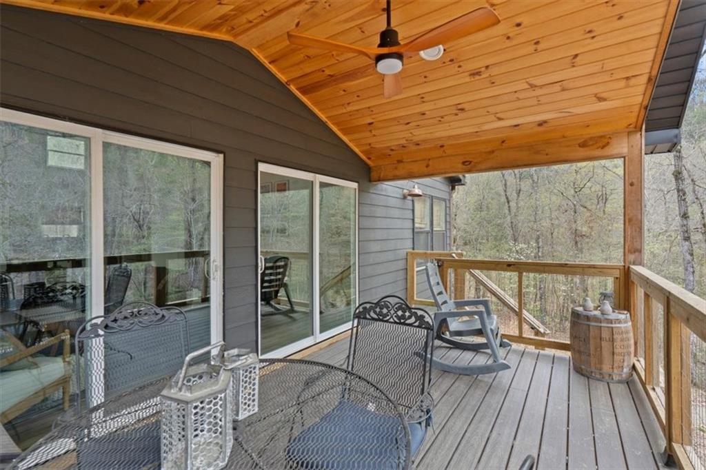 496 Meadow Lane Talking Rock, GA 30175 - Photo 40 of 62 a balcony with furniture and wooden floor