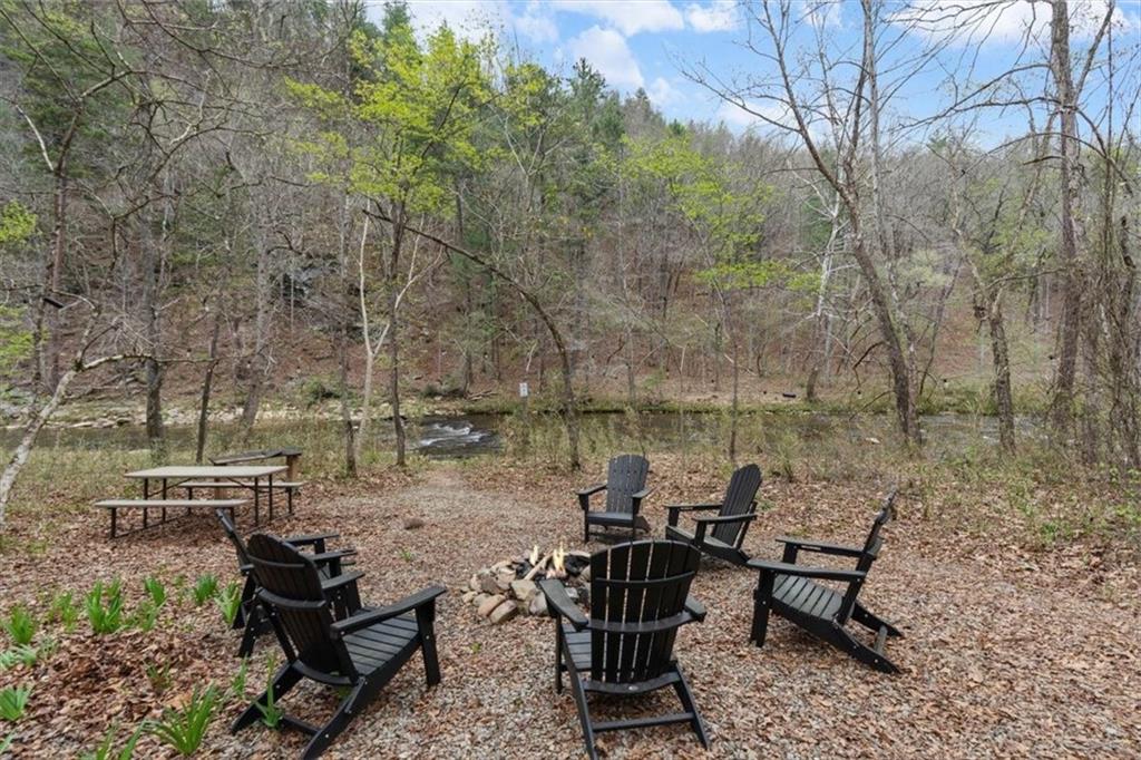 496 Meadow Lane Talking Rock, GA 30175 - Photo 43 of 62 a view of a lake with outdoor seating