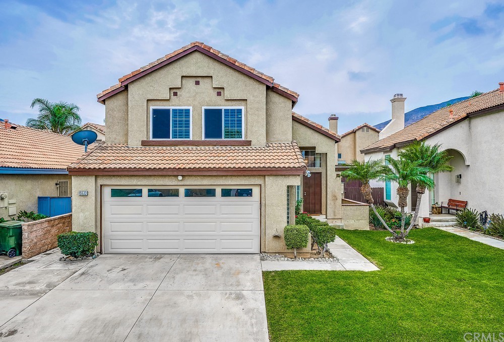 15533 Villa Del Rio Road Fontana, CA 92337 - Photo 1 of 1 a front view of a house with a yard and potted plants
