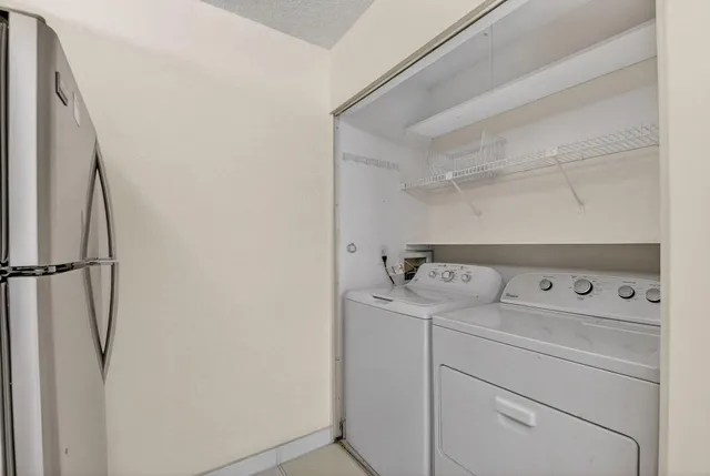a utility room with dryer and washer