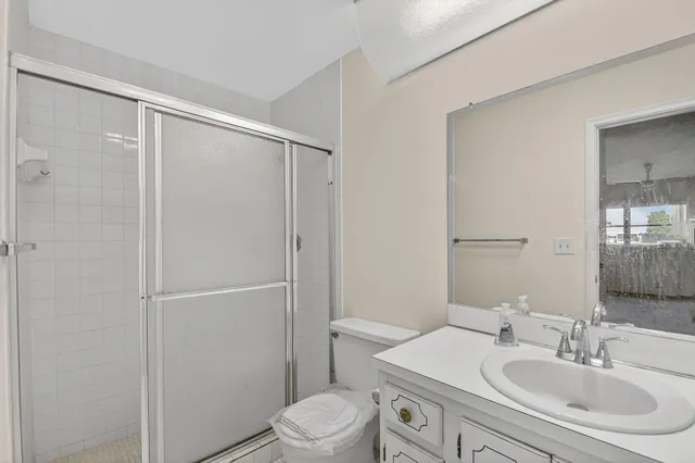 a bathroom with a sink toilet and vanity