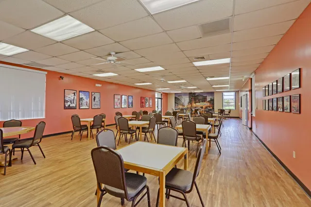 a room with gym equipment and white walls
