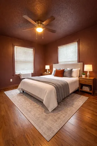 a bedroom with a bed and window