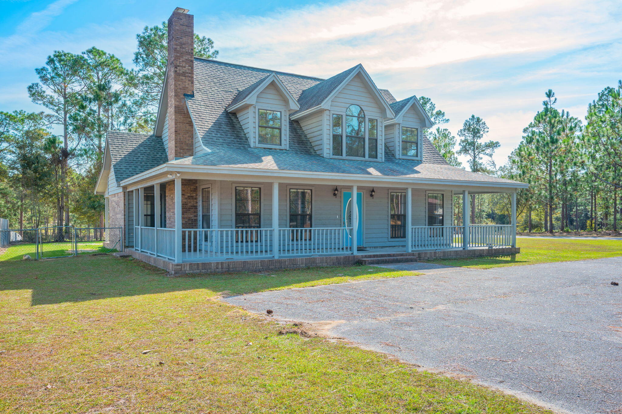1136 10 Lake Drive DeFuniak Springs, FL 32433 - Photo 1 of 53 a view of a house with swimming pool and a yard