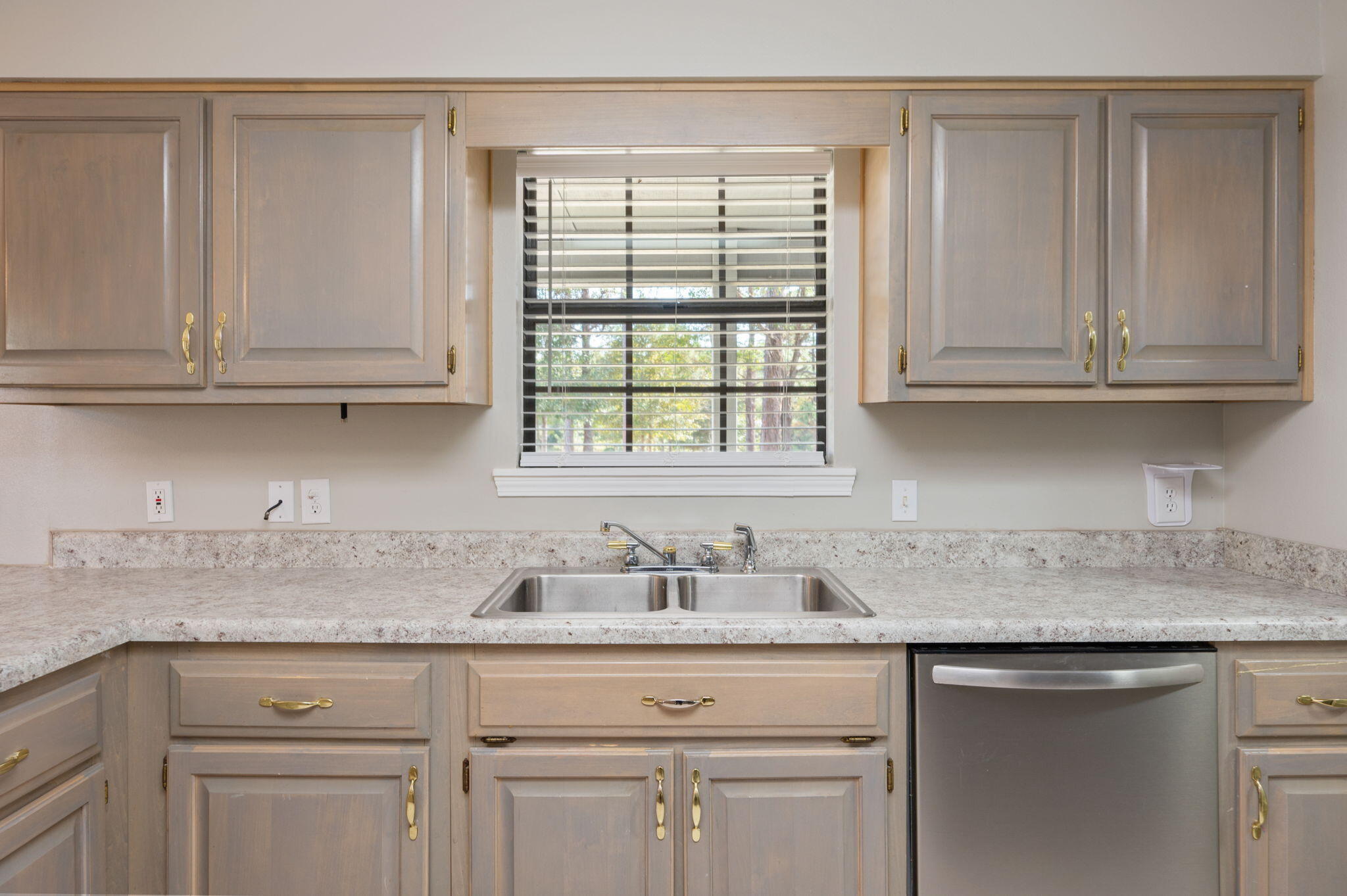 1136 10 Lake Drive DeFuniak Springs, FL 32433 - Photo 18 of 53 a kitchen with granite countertop white cabinets and a sink