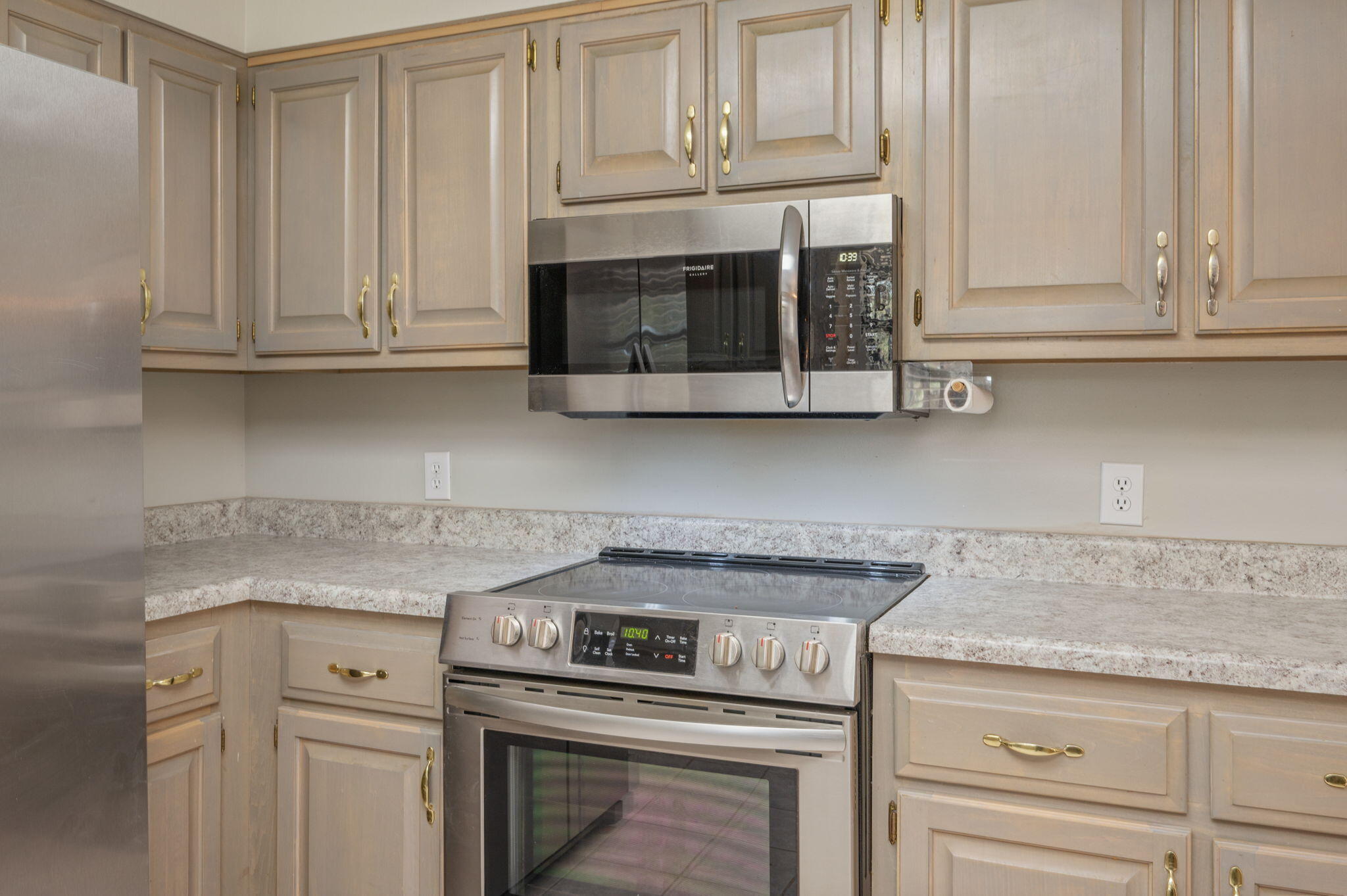 1136 10 Lake Drive DeFuniak Springs, FL 32433 - Photo 19 of 53 a kitchen with granite countertop white cabinets and stainless steel appliances