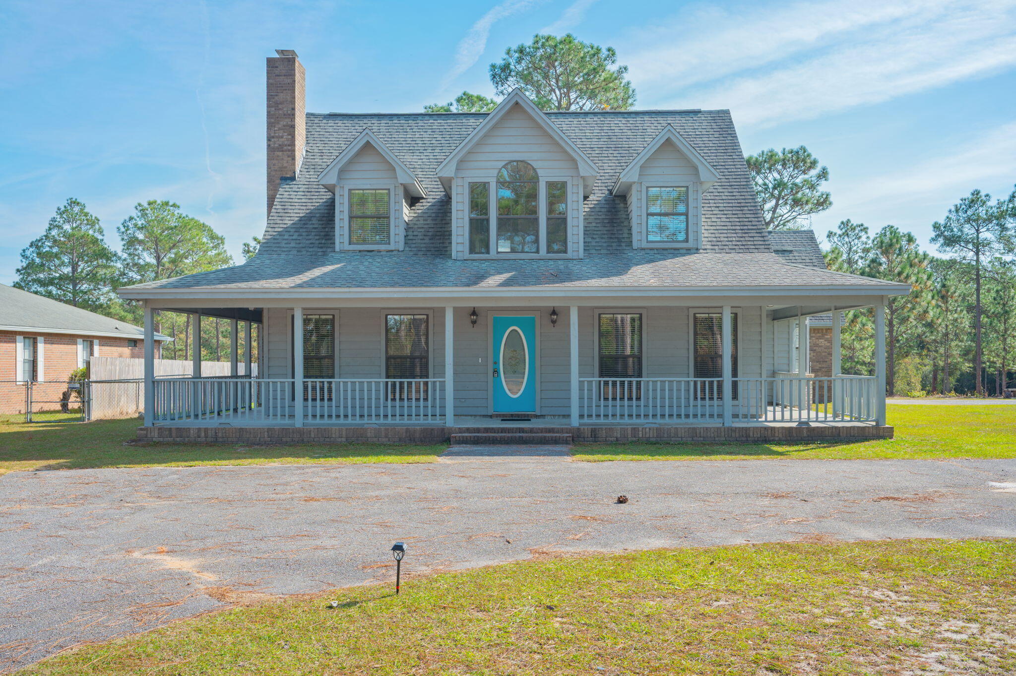 1136 10 Lake Drive DeFuniak Springs, FL 32433 - Photo 2 of 53 a front view of a house with a yard