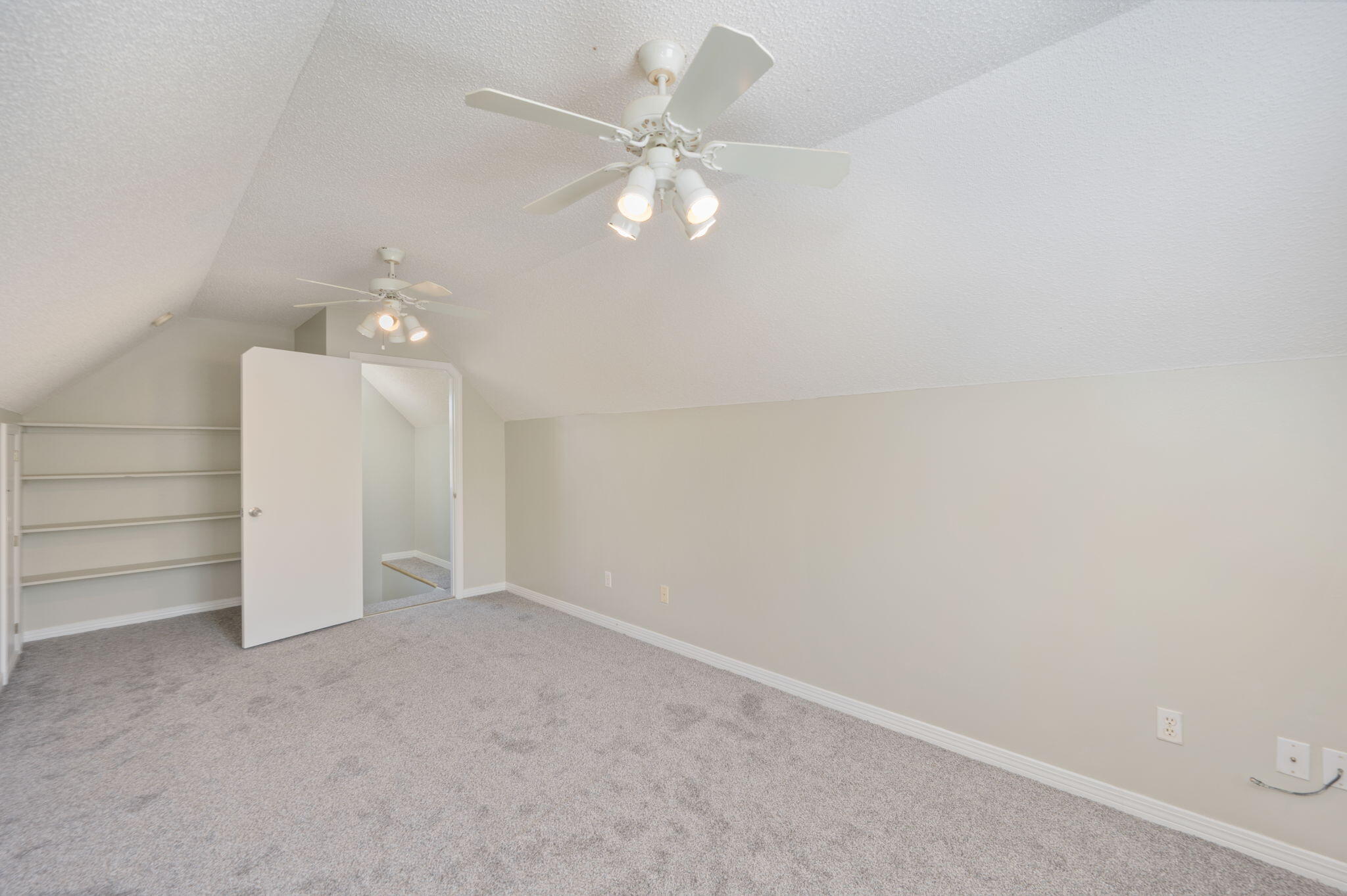 1136 10 Lake Drive DeFuniak Springs, FL 32433 - Photo 42 of 53 an empty room with a ceiling fan and window