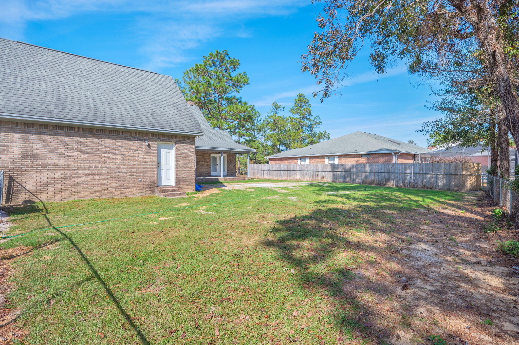 1136 10 Lake Drive DeFuniak Springs, FL 32433 - Photo 46 of 53 a view of a house with a yard