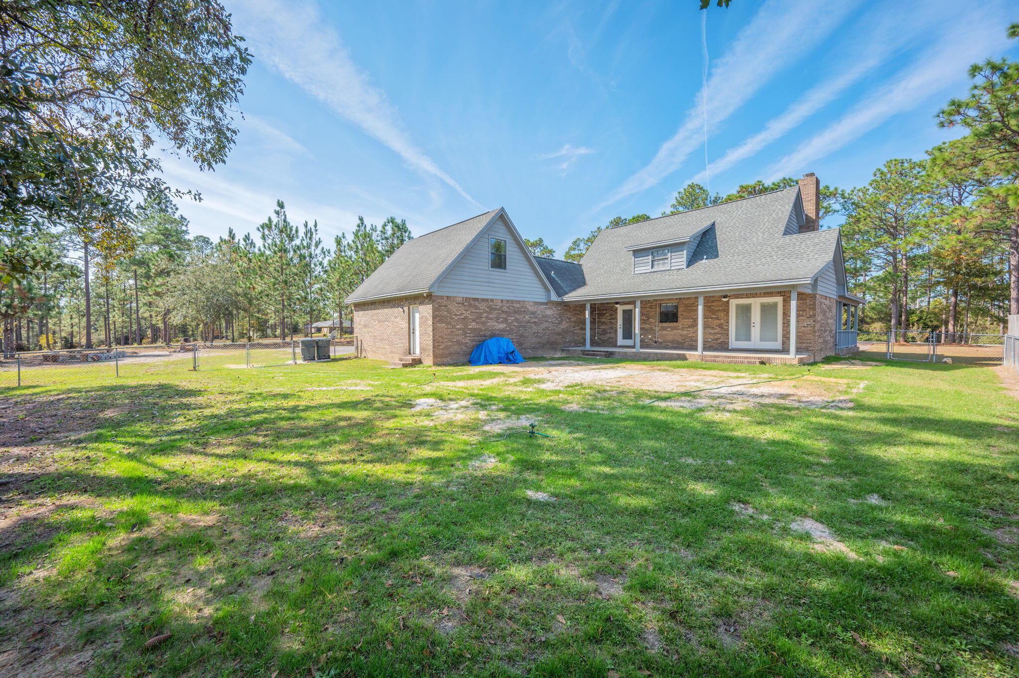 1136 10 Lake Drive DeFuniak Springs, FL 32433 - Photo 47 of 53 a view of a house with a yard