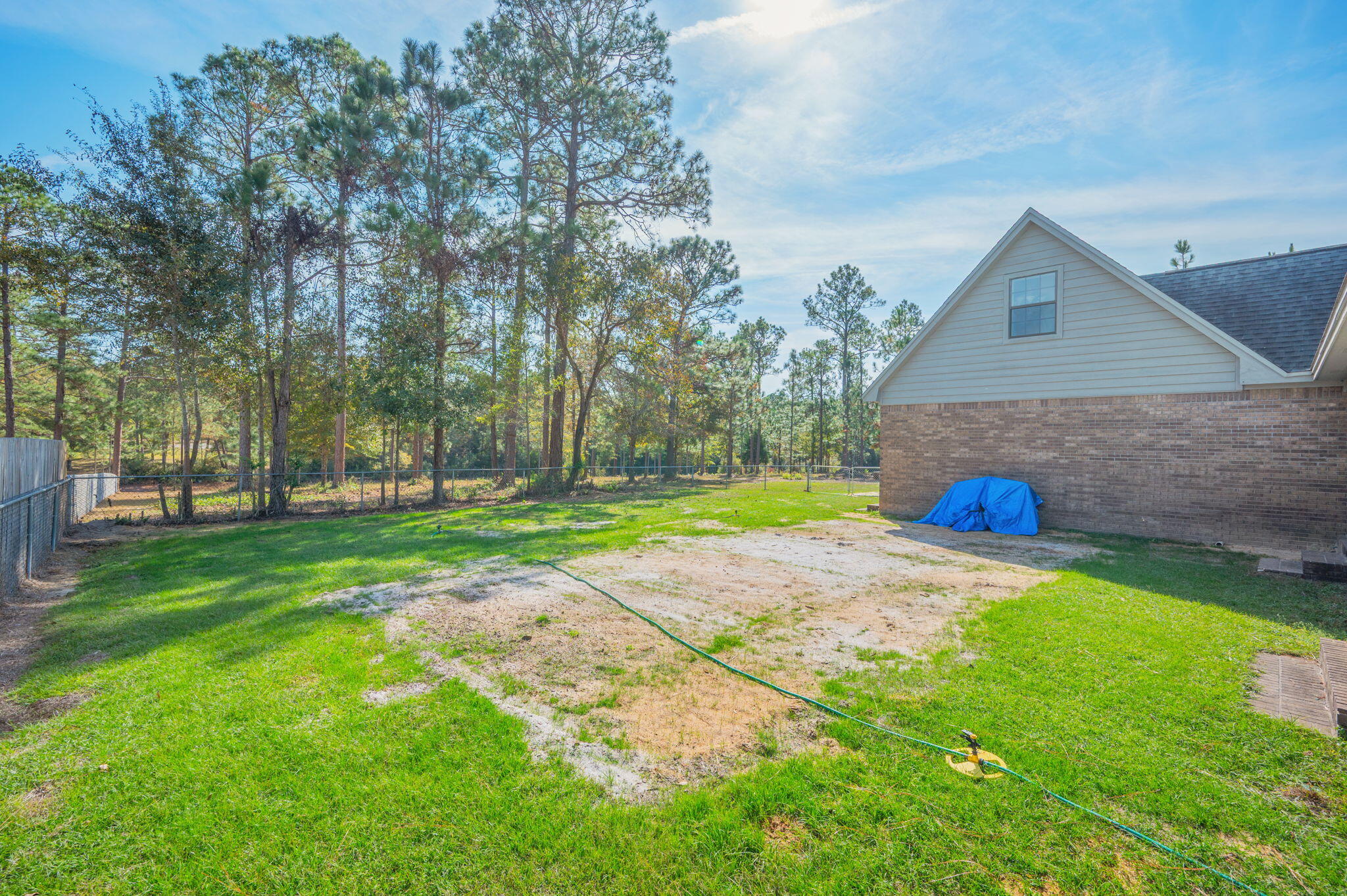 1136 10 Lake Drive DeFuniak Springs, FL 32433 - Photo 48 of 53 a view of a house with a yard