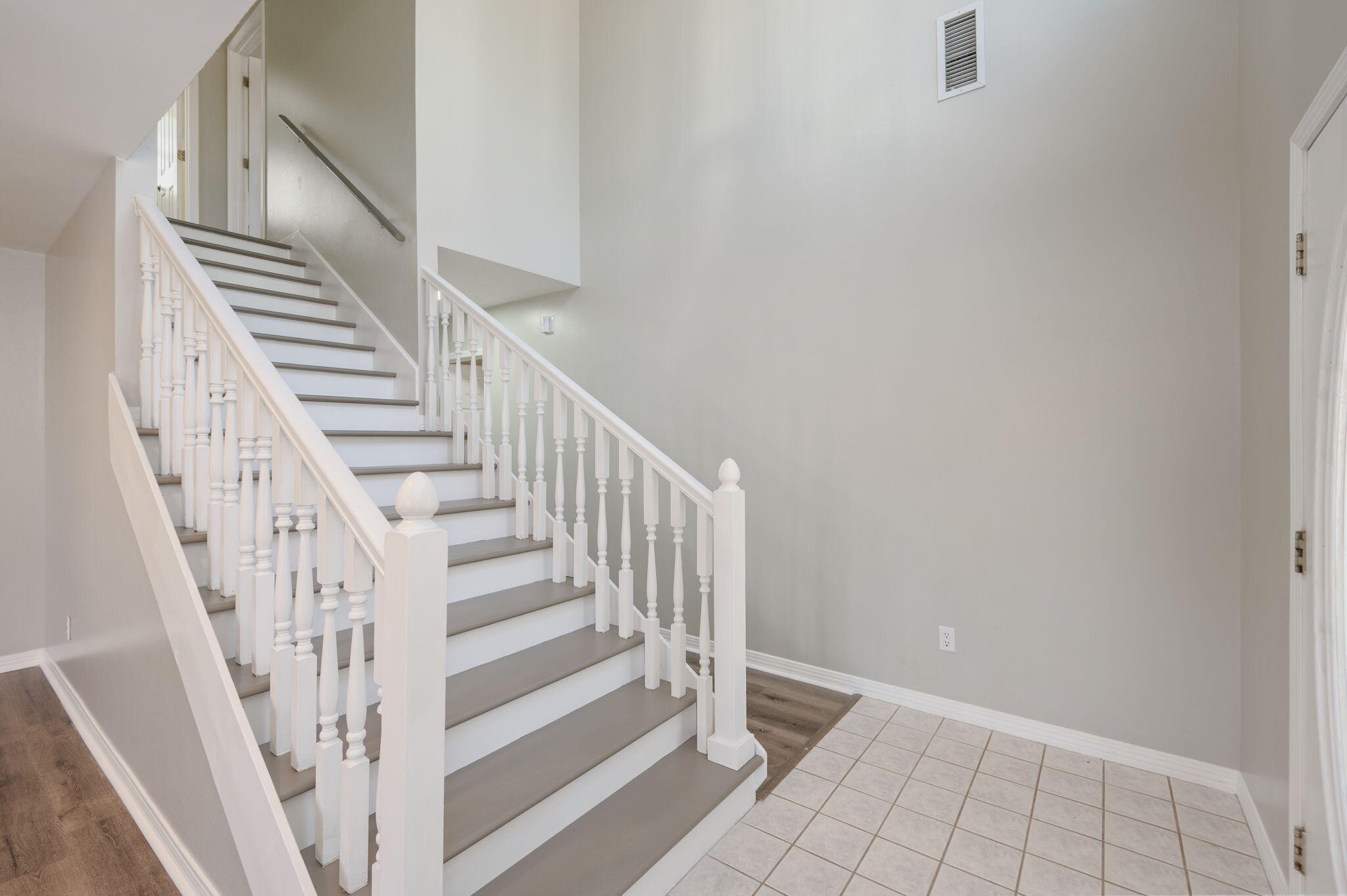 1136 10 Lake Drive DeFuniak Springs, FL 32433 - Photo 9 of 53 a view of staircase with white walls and white door