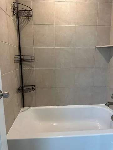 a bathroom with a bathtub and a sink