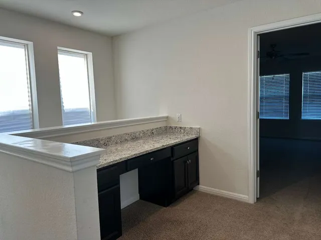 a view of a room with a hallway