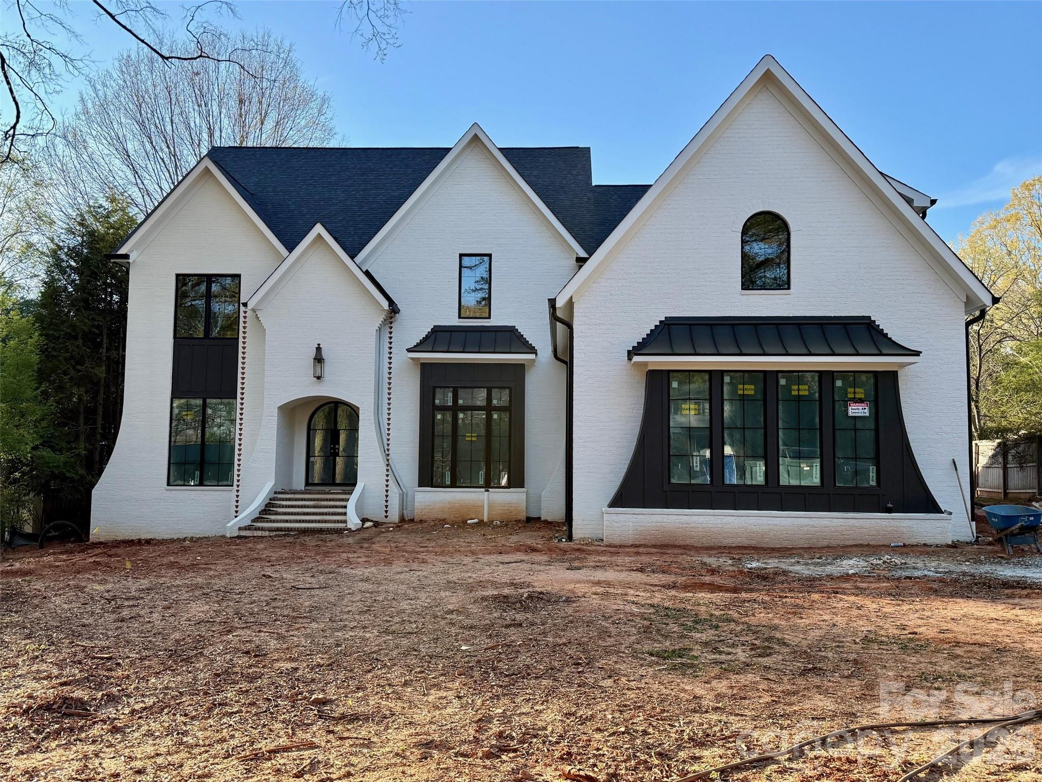 318 Lansdowne Road Charlotte, NC 28270 - Photo 2 of 5 a front view of a house with garden