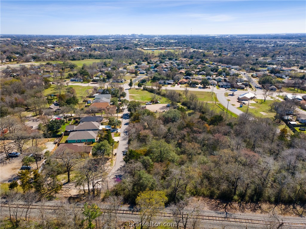 402 Wallace Street Bryan, TX 77803 - Photo 13 of 15 an aerial view of residential houses with outdoor space and trees