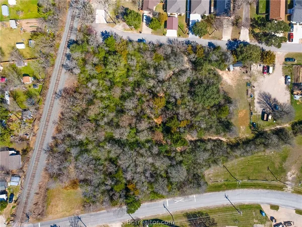 an aerial view of house with yard