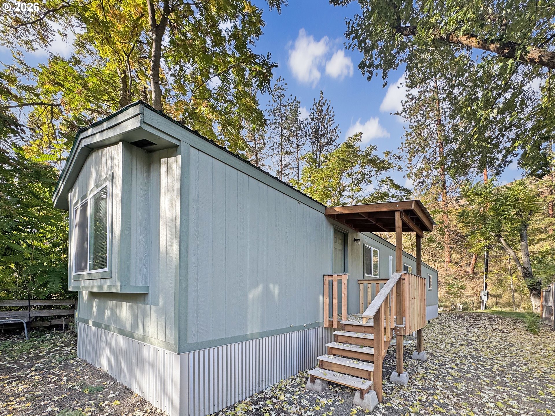 53945 Highway 86 Halfway, OR 97834 - Photo 4 of 48 a view of a house with wooden fence and trees