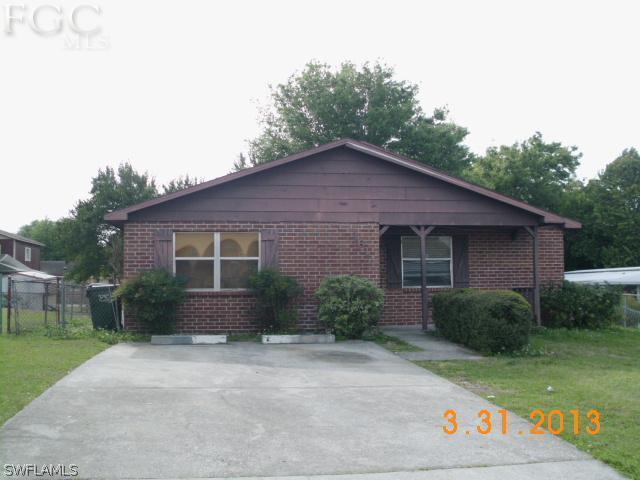 1614 Providence Road Lakeland, FL 33805 - Photo 1 of 13 a front view of a house with garden