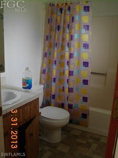 1614 Providence Road Lakeland, FL 33805 - Photo 12 of 13 a bathroom with a toilet and a sink