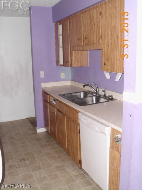 1614 Providence Road Lakeland, FL 33805 - Photo 3 of 13 a kitchen with a sink and cabinets