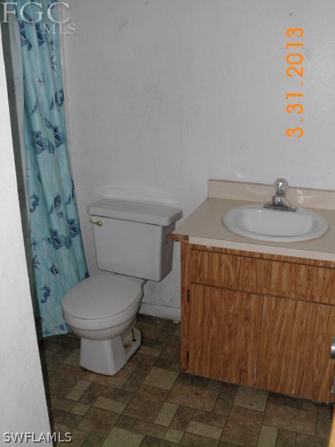 1614 Providence Road Lakeland, FL 33805 - Photo 6 of 13 a bathroom with a sink and a toilet