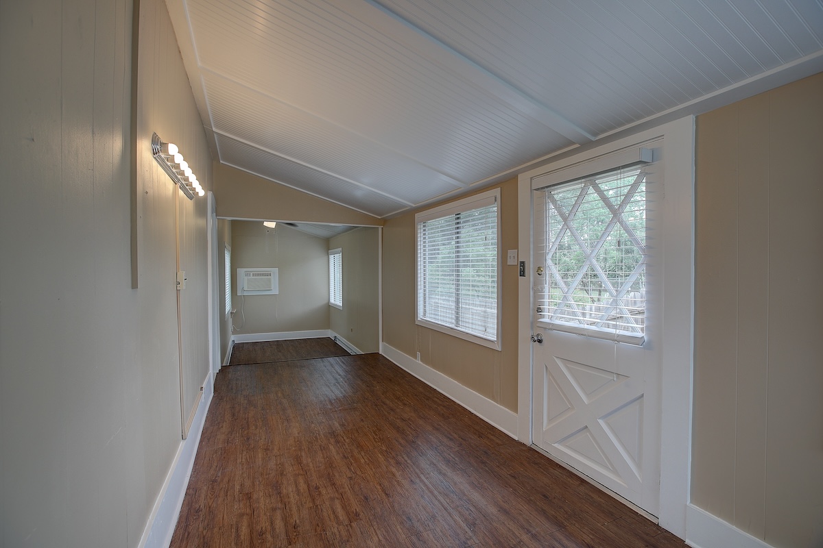 1708 Olive Street Georgetown, TX 78626 - Photo 37 of 40 a view of an empty room with wooden floor and a window