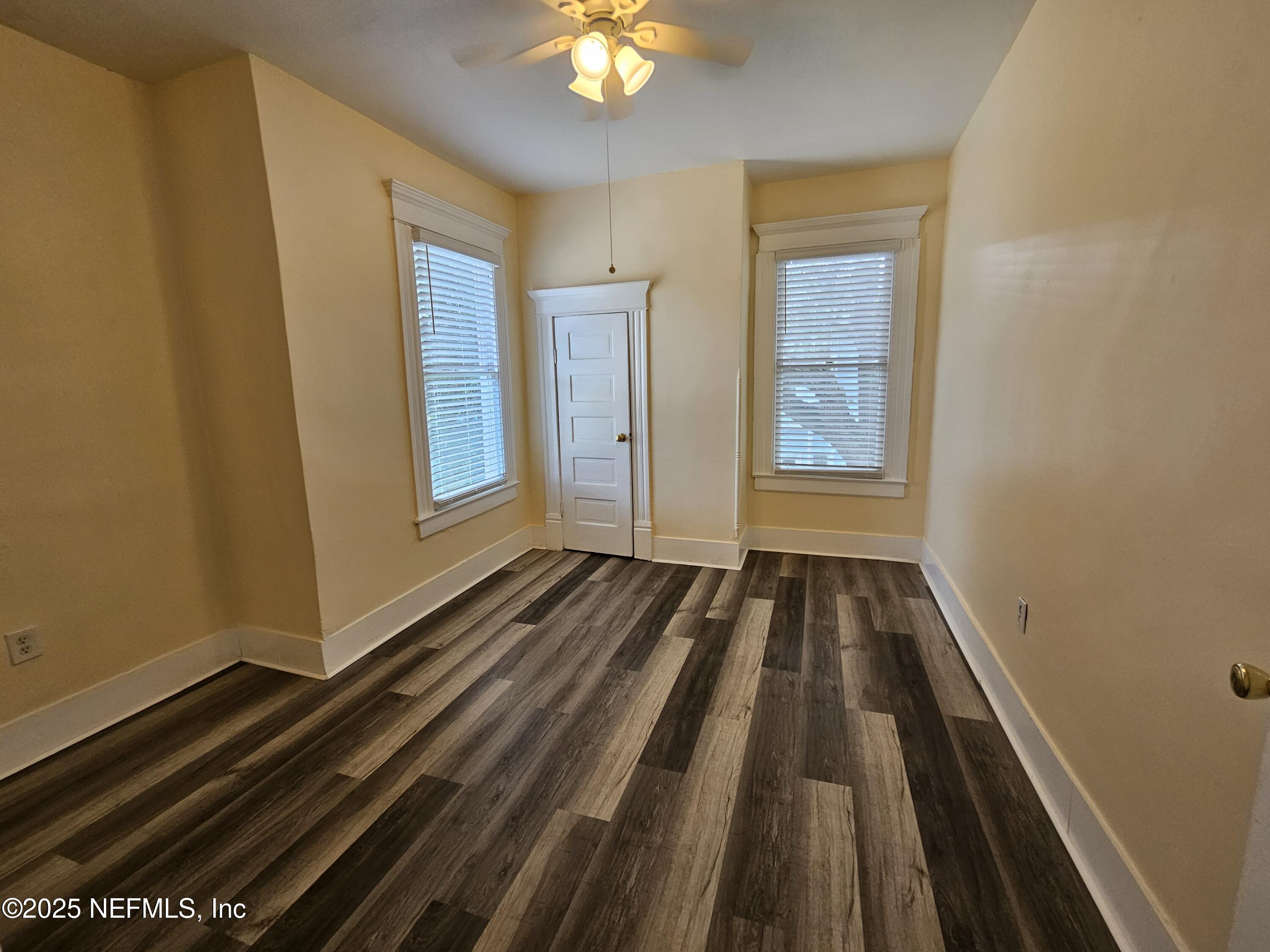 307 East 9th Street Jacksonville, FL 32206 - Photo 15 of 17 a view of a room with wooden floor and windows