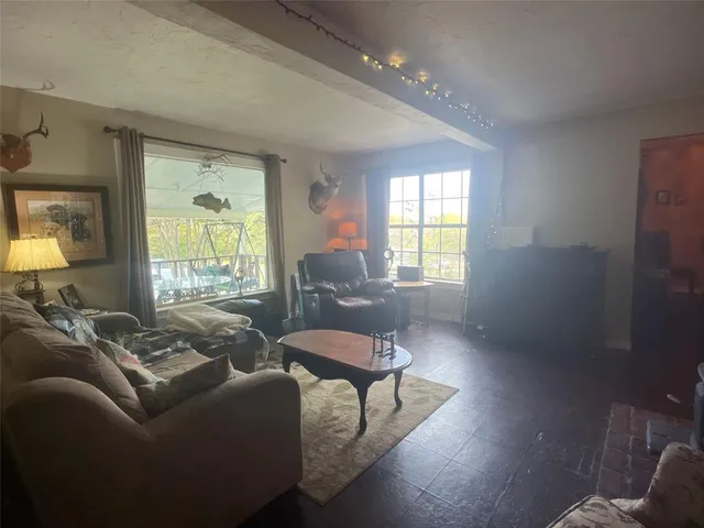 a kitchen with granite countertop a sink and cabinets