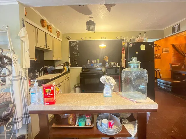 a view of a dining room with a table and chairs