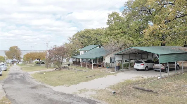 a view of a car park in front of house