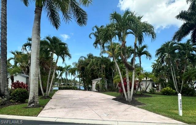 1404 Pearl Lake Point Naples, FL 34114 - Photo 1 of 9 a view of a park with palm trees