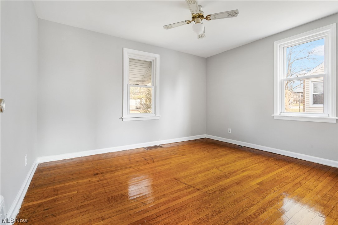2942 17th Street Northwest Canton, OH 44708 - Photo 14 of 25 Bedroom with a wealth of natural light, hardwood / wood-style flooring, and ceiling fan