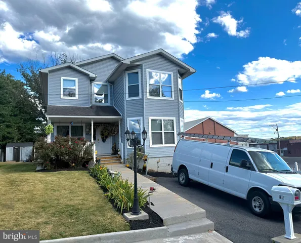 a front view of a house with parking space