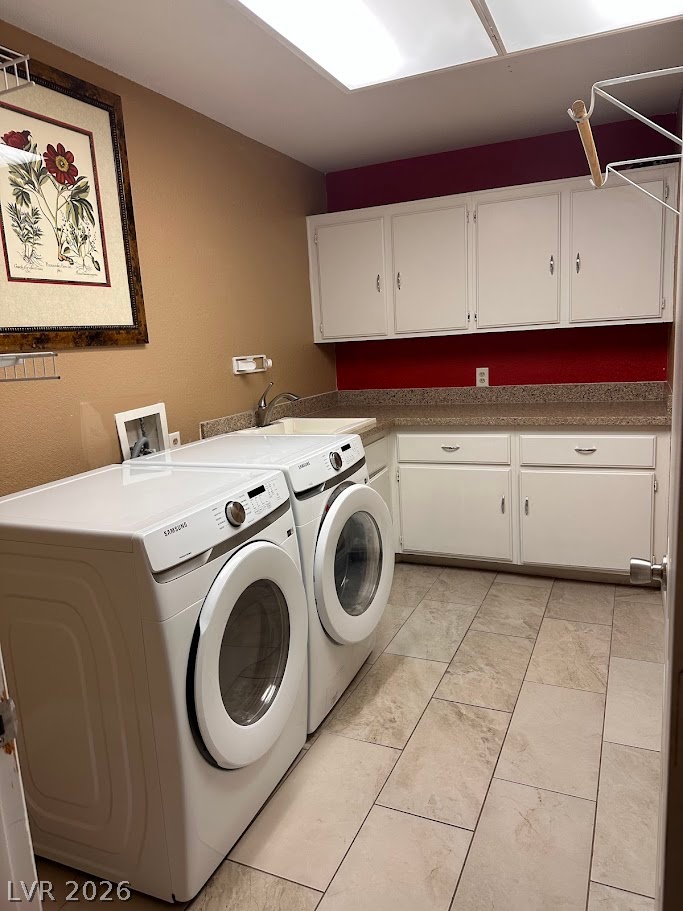 2600 Shakespeare Road Las Vegas, NV 89108 - Photo 5 of 6 Functional laundry room includes ample cabinetry, integrated sink, and durable tile flooring.