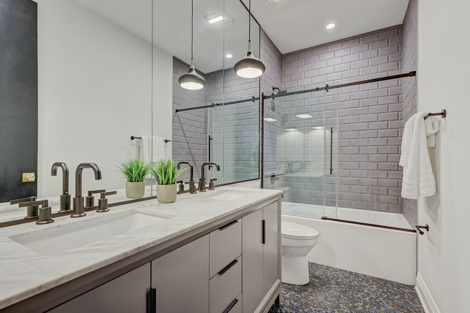 3406 North Keating Avenue Chicago, IL 60641 - Photo 23 of 30 a bathroom with a double vanity sink toilet and shower
