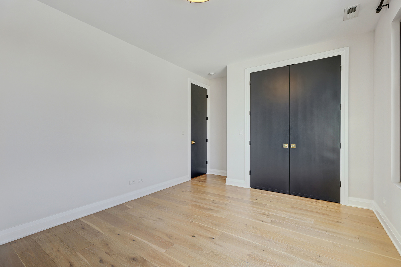3406 North Keating Avenue Chicago, IL 60641 - Photo 26 of 30 a view of an empty room with wooden floor