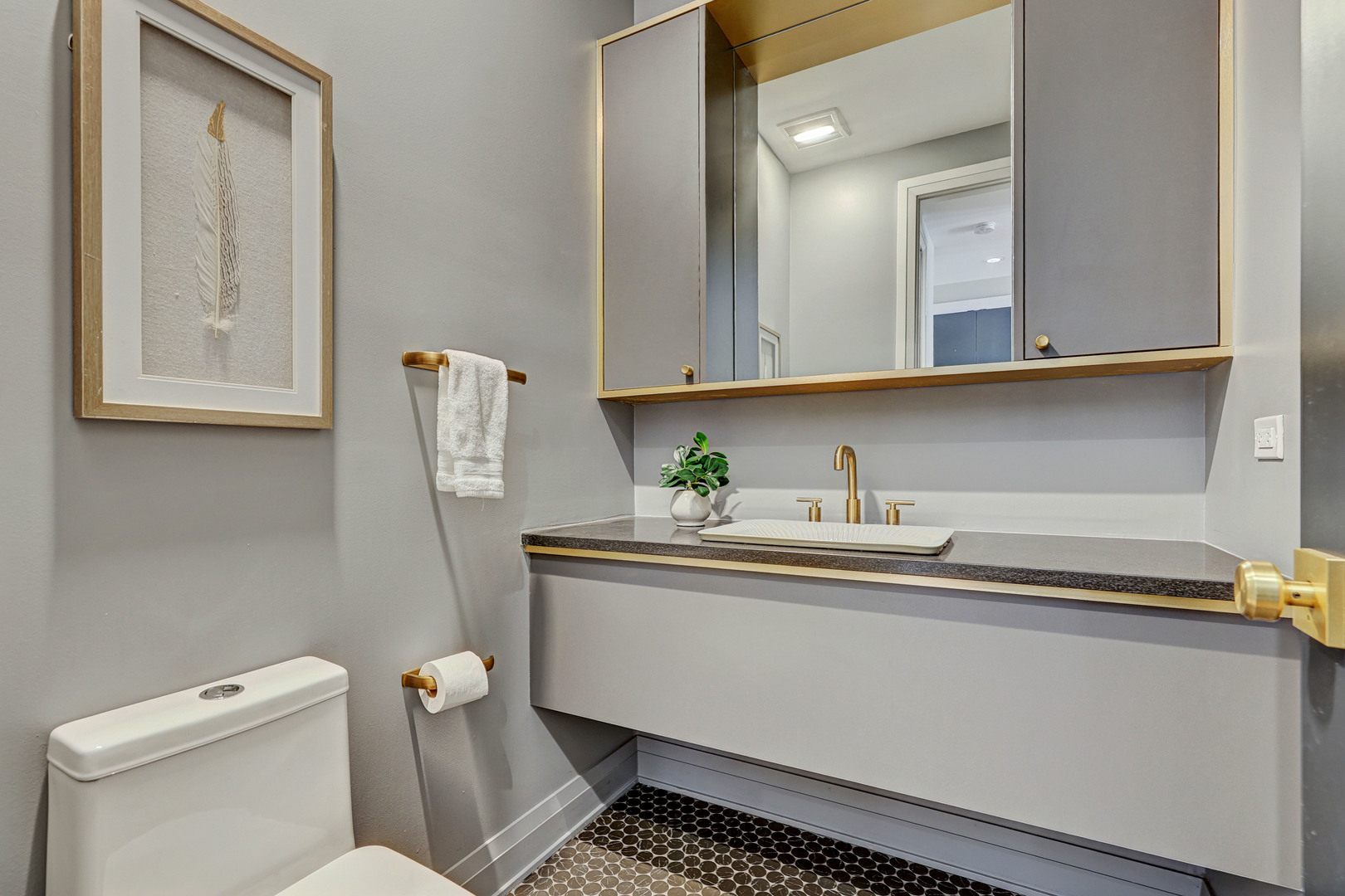 3406 North Keating Avenue Chicago, IL 60641 - Photo 29 of 30 a bathroom with a toilet sink and mirror