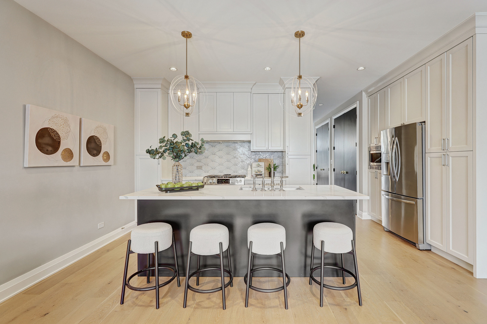 3406 North Keating Avenue Chicago, IL 60641 - Photo 10 of 30 a kitchen with kitchen island stainless steel appliances a dining table chairs sink and cabinets