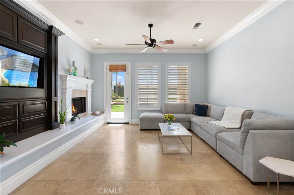 6572 Beachview Drive Huntington Beach, CA 92648 - Photo 6 of 17 a living room with furniture and a flat screen tv