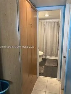 a bathroom with a shower and a sink
