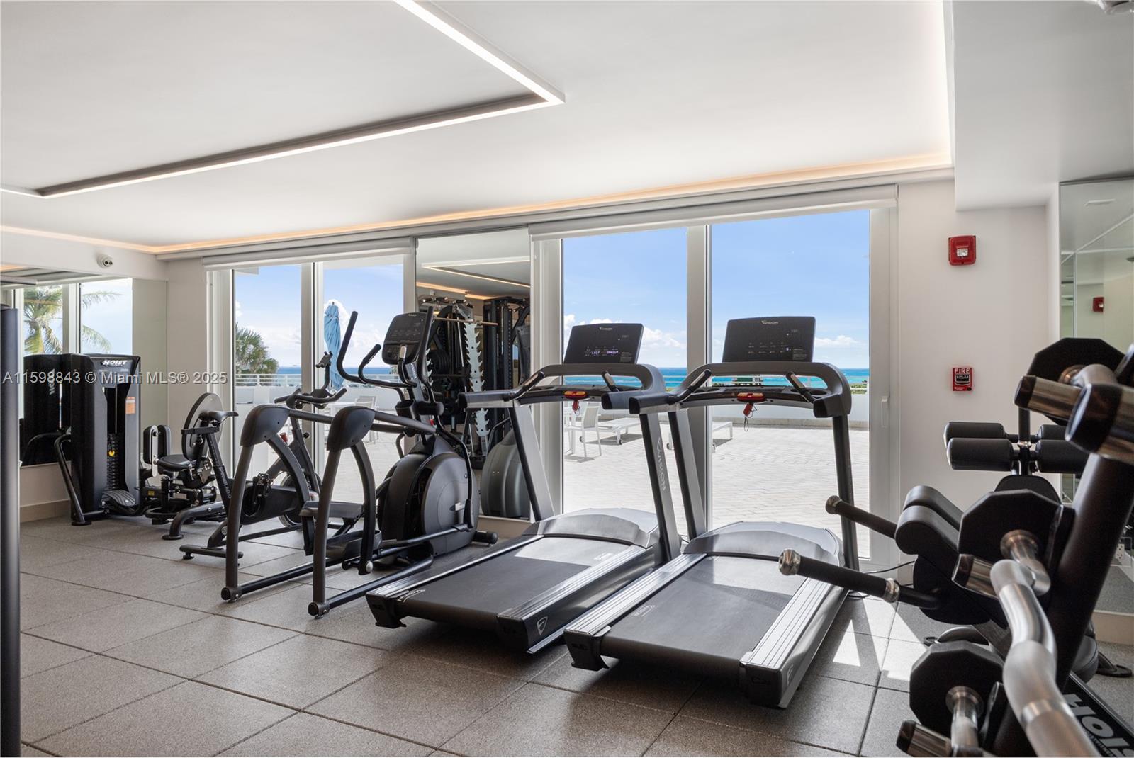 345 Ocean Drive, Unit 714 Miami Beach, FL 33139 - Photo 18 of 32 a view of a room with gym equipment